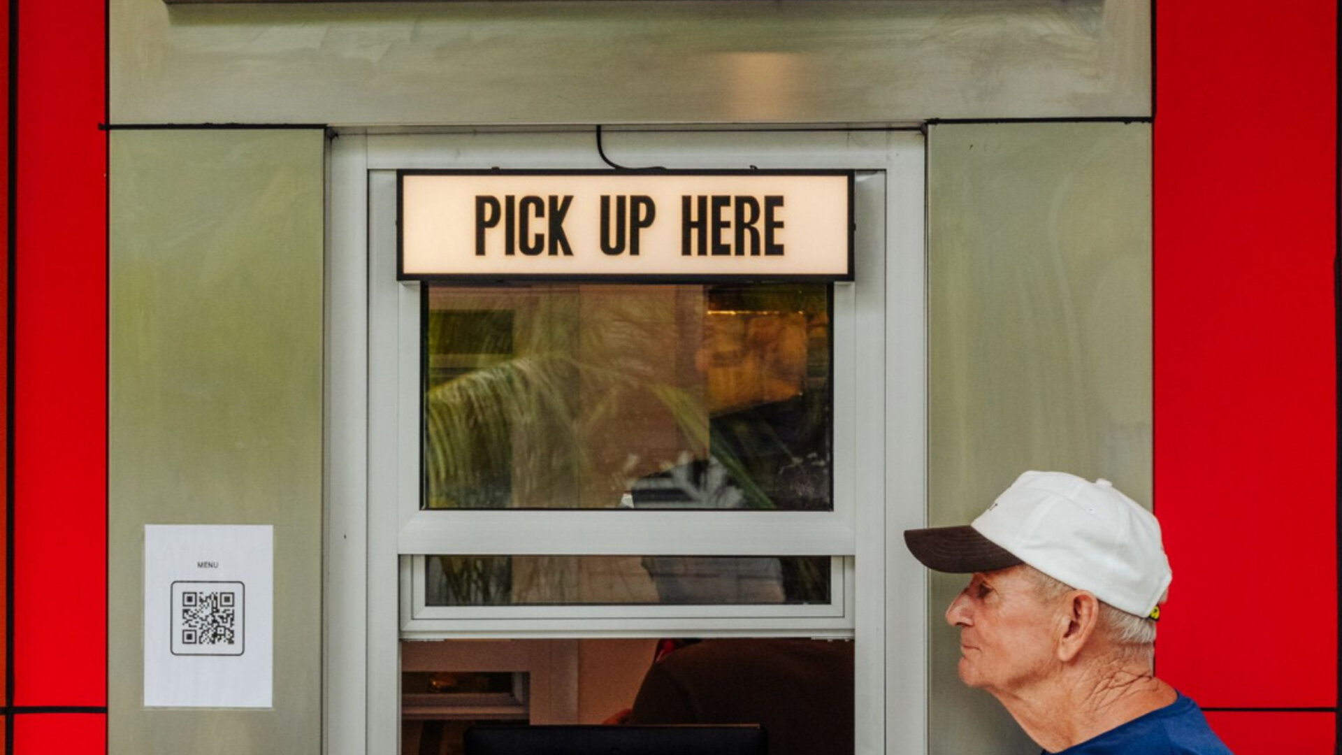 Doughboys Bali Canggu restaurant with customer picking up fresh hot pizza
