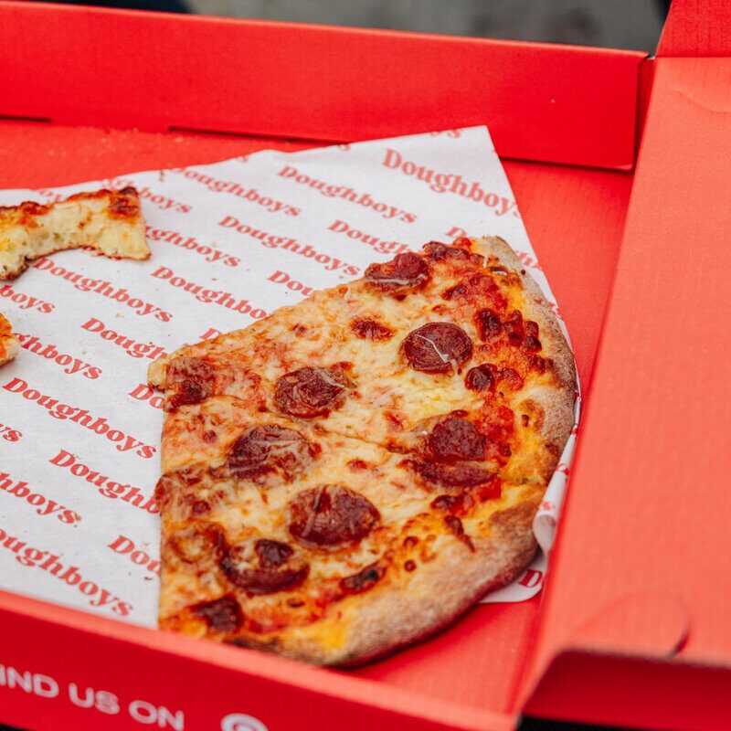 Delicious pepperoni pizza in Doughboys signature red box